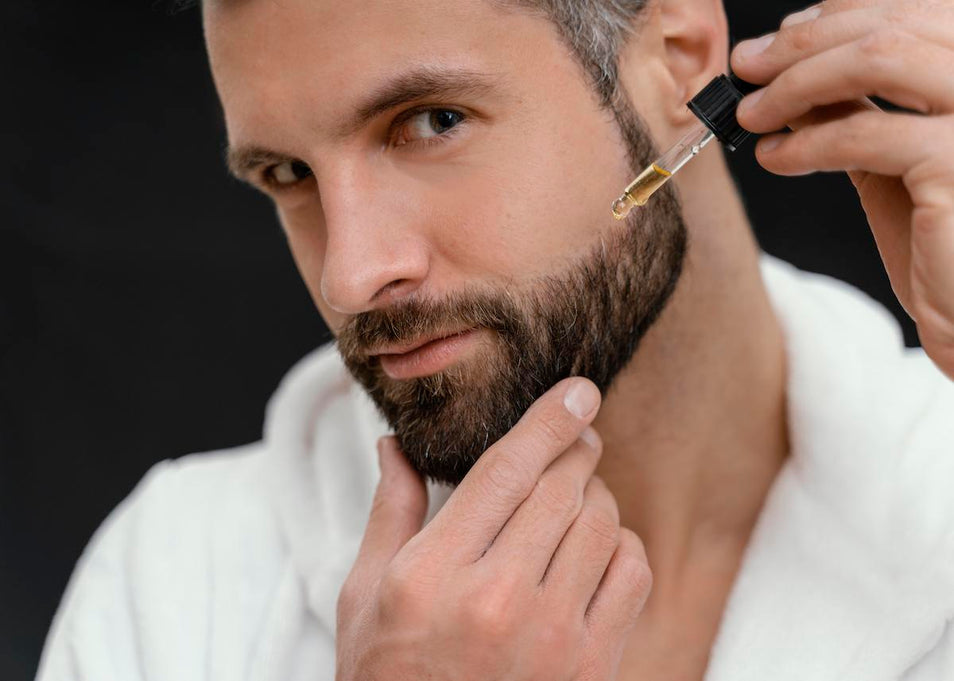 man applying beard oil everyday
