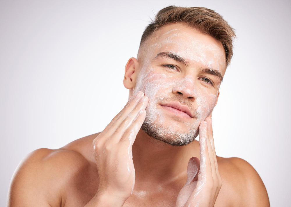 white man using soap to wash his beard
